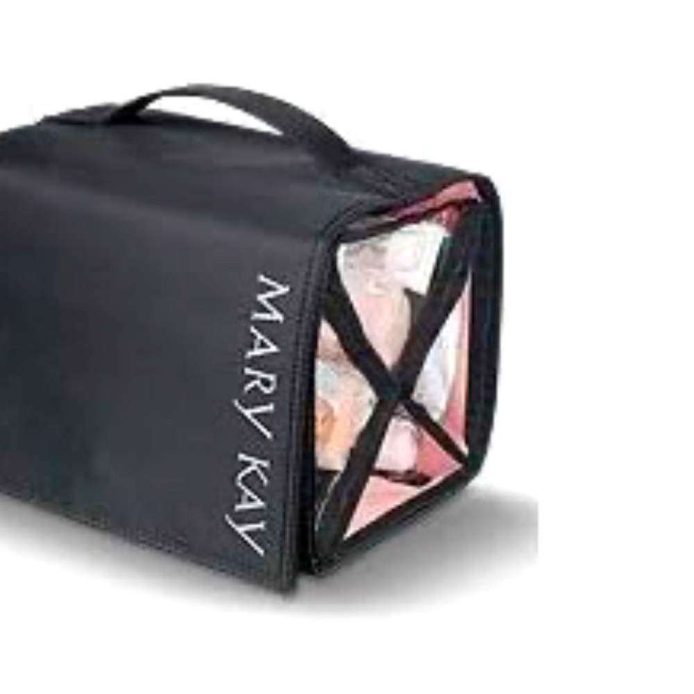MaryKay travel roll up bag. Features a black nylon exterior, pink interior